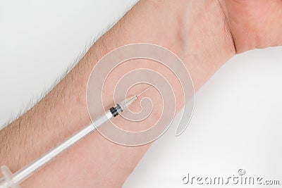 Insuline injector on the arm Stock Photo
