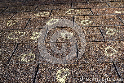 Insurance Adjuster Marked Roof With Hail Damage Stock Photo