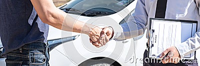 Insurance agent shaking hands client after examine the damage of the car after accident on report claim form process Stock Photo