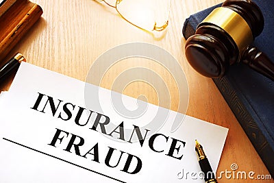 Insurance fraud written on a documents. Stock Photo