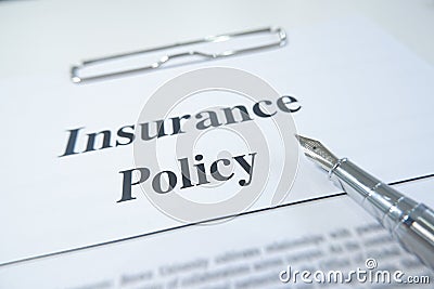 Insurance policy form and pen on desk in office showing risk concept. Life; Health, car, travel Stock Photo