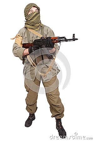 Insurgent wearing keffiyeh with AK 47 gun Stock Photo