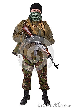 Insurgent wearing shemagh with kalashnikov rifle Stock Photo