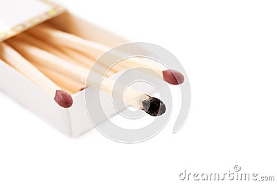 Intact and burnt matches Stock Photo