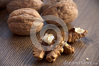 Intact Walnut shells and the kernal or meat Stock Photo
