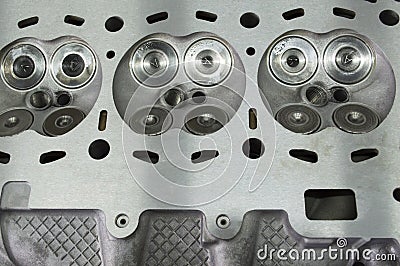 Intake and exhaust valves installed in the engine block head Stock Photo