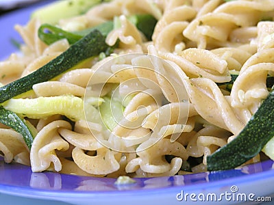 Integral pasta with zucchinis Stock Photo