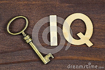 Intelligence quotient, iq test concept, key with letters on a wooden background Stock Photo