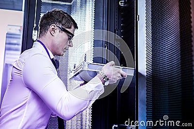 Intelligent professional male hacker stealing digital data Stock Photo
