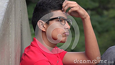 Intelligent Teen Hispanic Boy Thinking Stock Photo