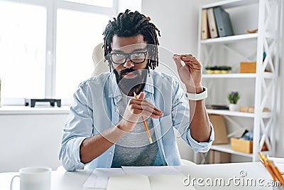 Intelligent young African man Stock Photo