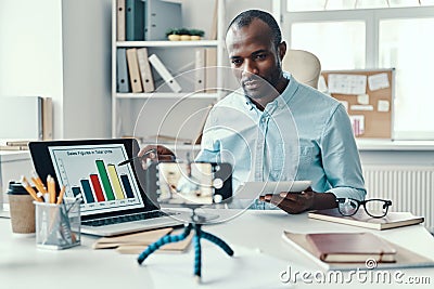 Intelligent young African man in shirt Stock Photo