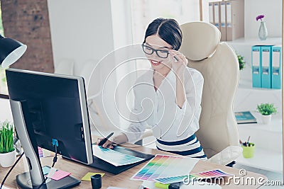 Intelligent young asian graphic designer is working with compute Stock Photo