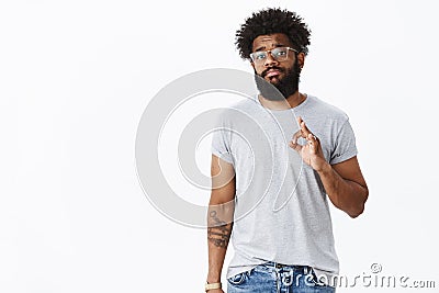 Intense bothered and uncertain guy pulling grimace and sad face as showing okay gesture unwilling accept terms but Stock Photo