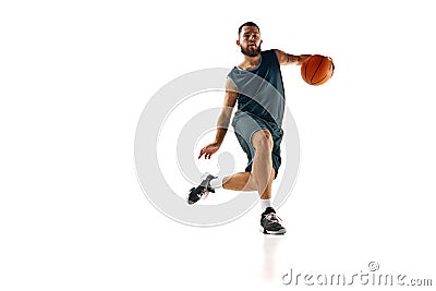 Intense concentration of basketball player during training session, emphasizing commitment to excellence against white Stock Photo