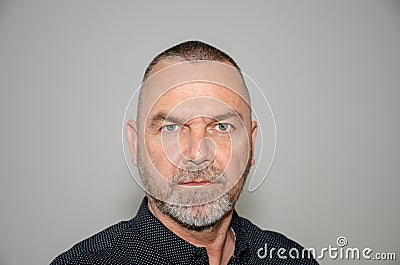 Intense determined man staring at the camera Stock Photo