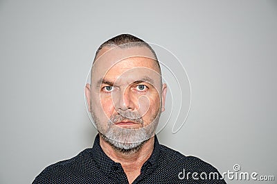 Intense determined man staring at the camera Stock Photo