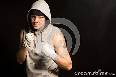 Intense determined young boxer Stock Photo