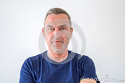 Intense focused middle-aged man with serious look Stock Photo