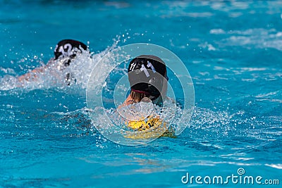 Intensity shows in the competing water athletes Editorial Stock Photo