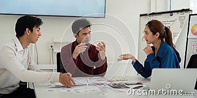 Interactive UX UI Brainstorming. Designers animatedly discuss creative ideas and approaches for effective user interface Stock Photo