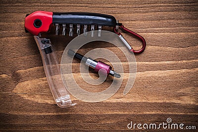 Interchangeable turnscrew bits in toolbox on wood board construc Stock Photo