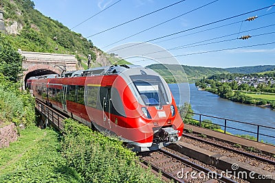 Intercity train near the river Moselle in Germany Stock Photo