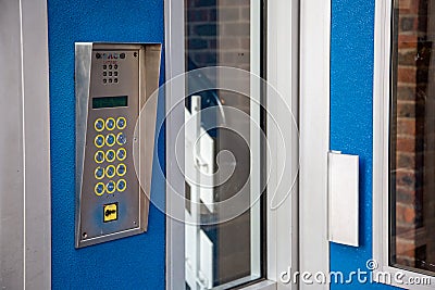 A intercom system on the exterior of a block of flats used for gaining access Editorial Stock Photo