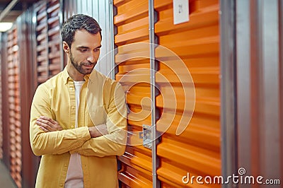 Interested man looking at garage lock Stock Photo
