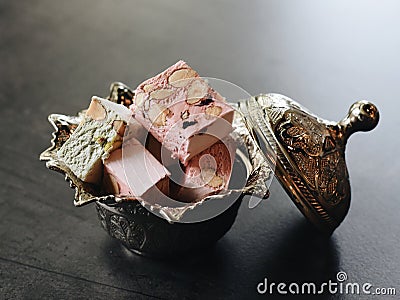 Interesting Candy Dessert in Silver Bowl. Fine Dining Food in Restaurant Stock Photo