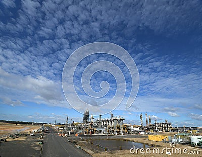 Interesting cloud formation over a construction site. Stock Photo