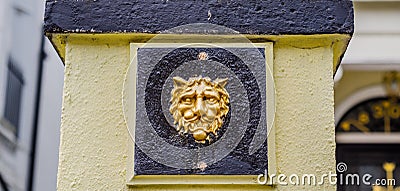 Interesting decoration in the shape of a lion`s head placed on t Stock Photo