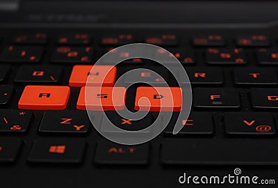 Interesting detail - keyboard of a notebook, red and black Stock Photo
