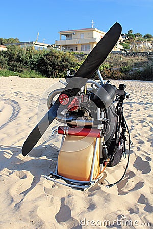 Gasoline engine and propeller for paragliding sail on the beach Editorial Stock Photo
