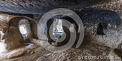 Interior of an ancient house carved into the rock in Zelve Stock Photo