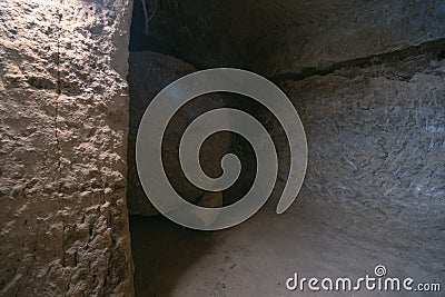 The interior of an ancient underground city on the territory of Cappadocia. Stone hatch, defense system, blocking the passage.. Stock Photo