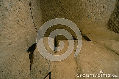 The interior of an ancient underground city on the territory of Cappadocia. Stone hatch, defense system, blocking the passage.. Stock Photo