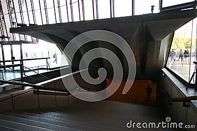 Entryway covered by concrete canopy ceiling with exposed beams over entrance stairway on inside of Sydney Opera House, Australia Editorial Stock Photo