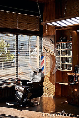 Interior of barbershop with professional barber chair Stock Photo