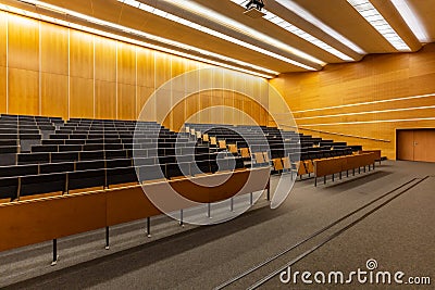 Interior of big conference hall full of gray folding chairs Stock Photo