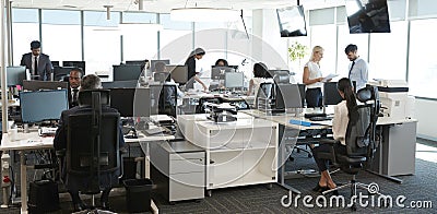 Interior Of Busy Modern Open Plan Office With Staff Stock Photo