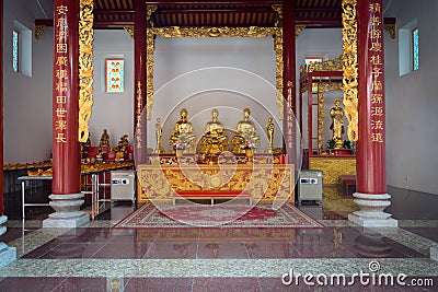 Interior of Canton Shrine with Golden Idols on an Ornate Altar Editorial Stock Photo