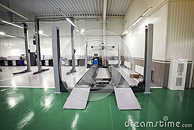 interior car-care center. The electric lift for cars in the service,car repair service centre,small service Stock Photo