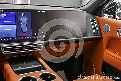 Interior of a car detail SUV Lixiang L9 luxury. Central display, armrests with cup holders. Editorial Stock Photo