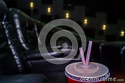 The interior of a cinema hall with black leather seats. The film does not show and no people Stock Photo