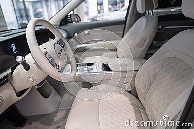 Interior, cockpit, bright car interior Hyundai Genesis GV60 model, driver and passenger seats, korean Electric Hyundai Motor Editorial Stock Photo
