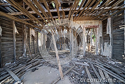 Interior of the completely damaged and abandoned former Glenrio Texas post office Stock Photo