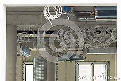 Interior construction site. Cabling and wiring of new office place Stock Photo