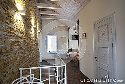 Interior of a contemporary home with spacious hallway, room doors and staircase railing in modern style Stock Photo