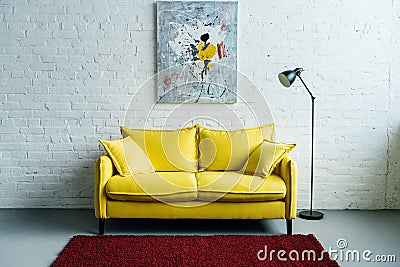 Interior of cozy living room with painting on wall, sofa and floor Editorial Stock Photo